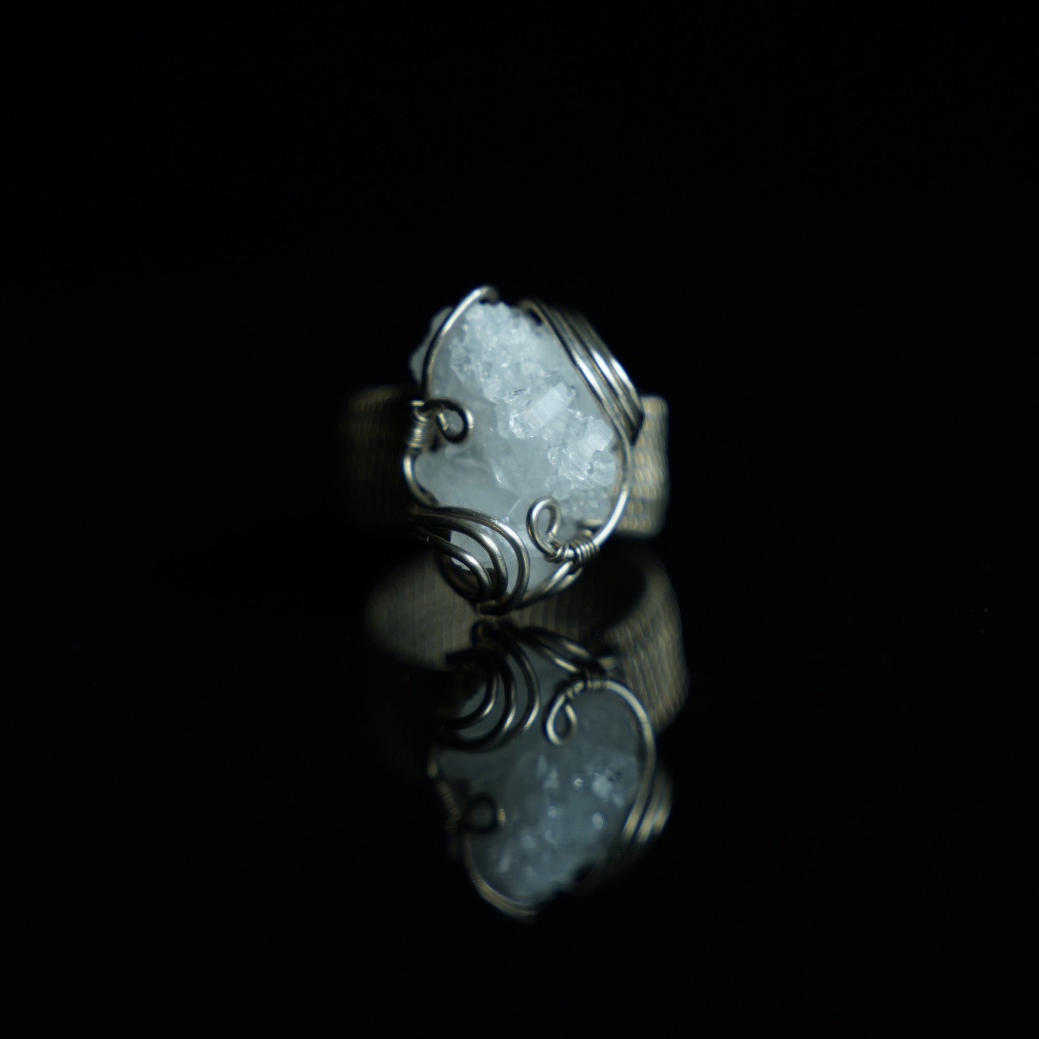 The Quiet Frost natural crystal cluster ring with hand-shaped white copper wirework, frontview