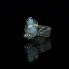 Side view of The Quiet Frost natural crystal cluster ring showing its white copper wirework andring band