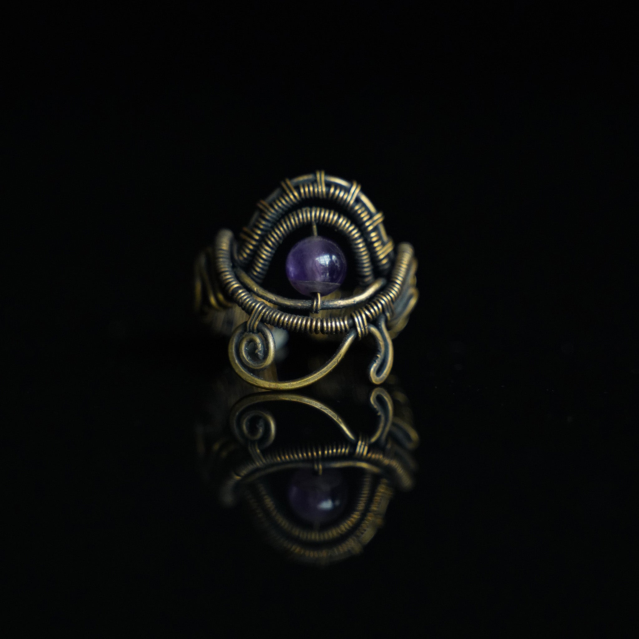 The Timekeeper natural amethyst ring with hand-shaped brass wirework, front view