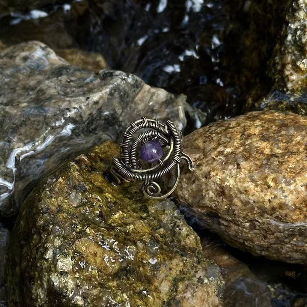 The Timekeeper handmade amethyst brass ring photographed outdoors