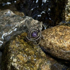 The Timekeeper handmade amethyst brass ring photographed outdoors