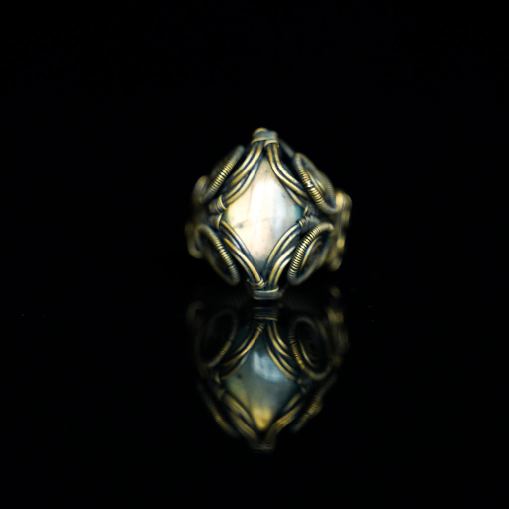 The Veil natural labradorite ring with hand-shaped brass wirework, front view