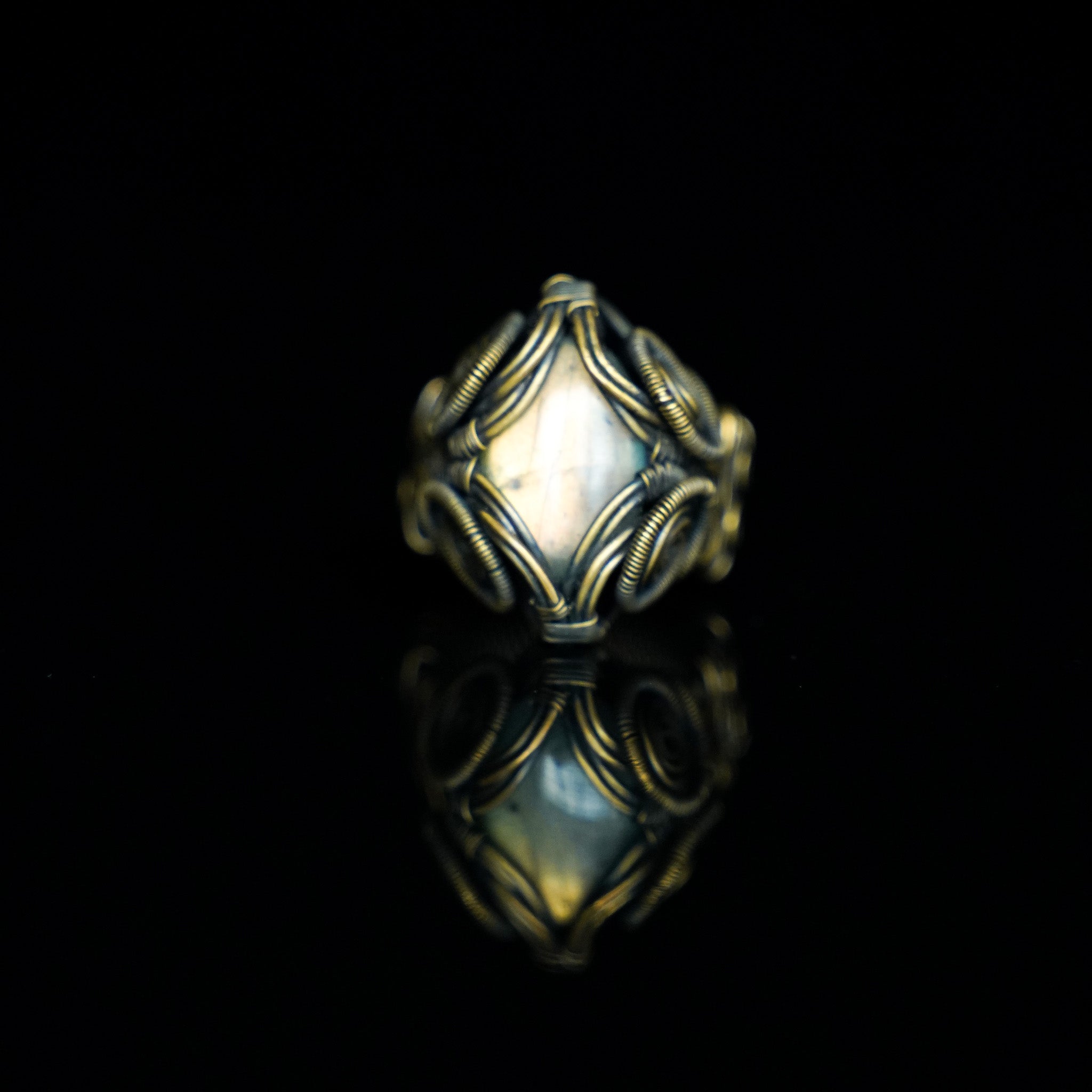 The Veil natural labradorite ring with hand-shaped brass wirework, front view